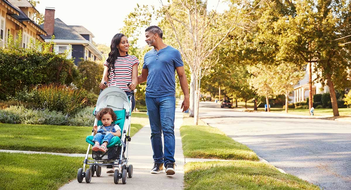 Happy active couple walking with baby. can cbd help with your libido? best cbd oil for libido. cbd oil for women's libido.