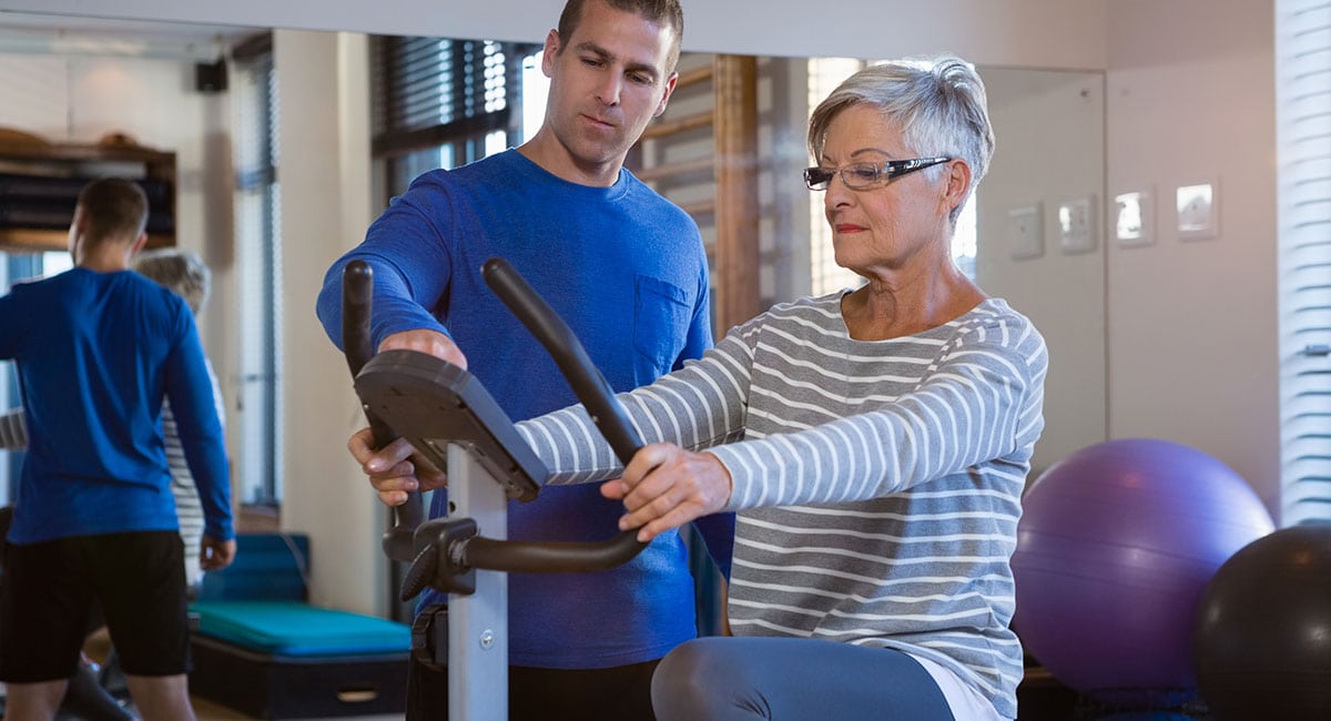 Elderly woman using CBD pre workout for muscle recovery. best cbd oil for muscle recovery.